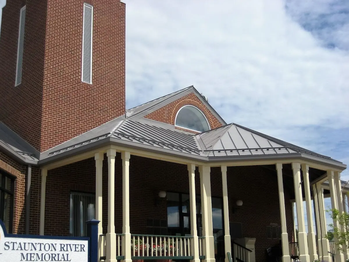 Skilled roofing craftsmen working on a residential roof in Akron